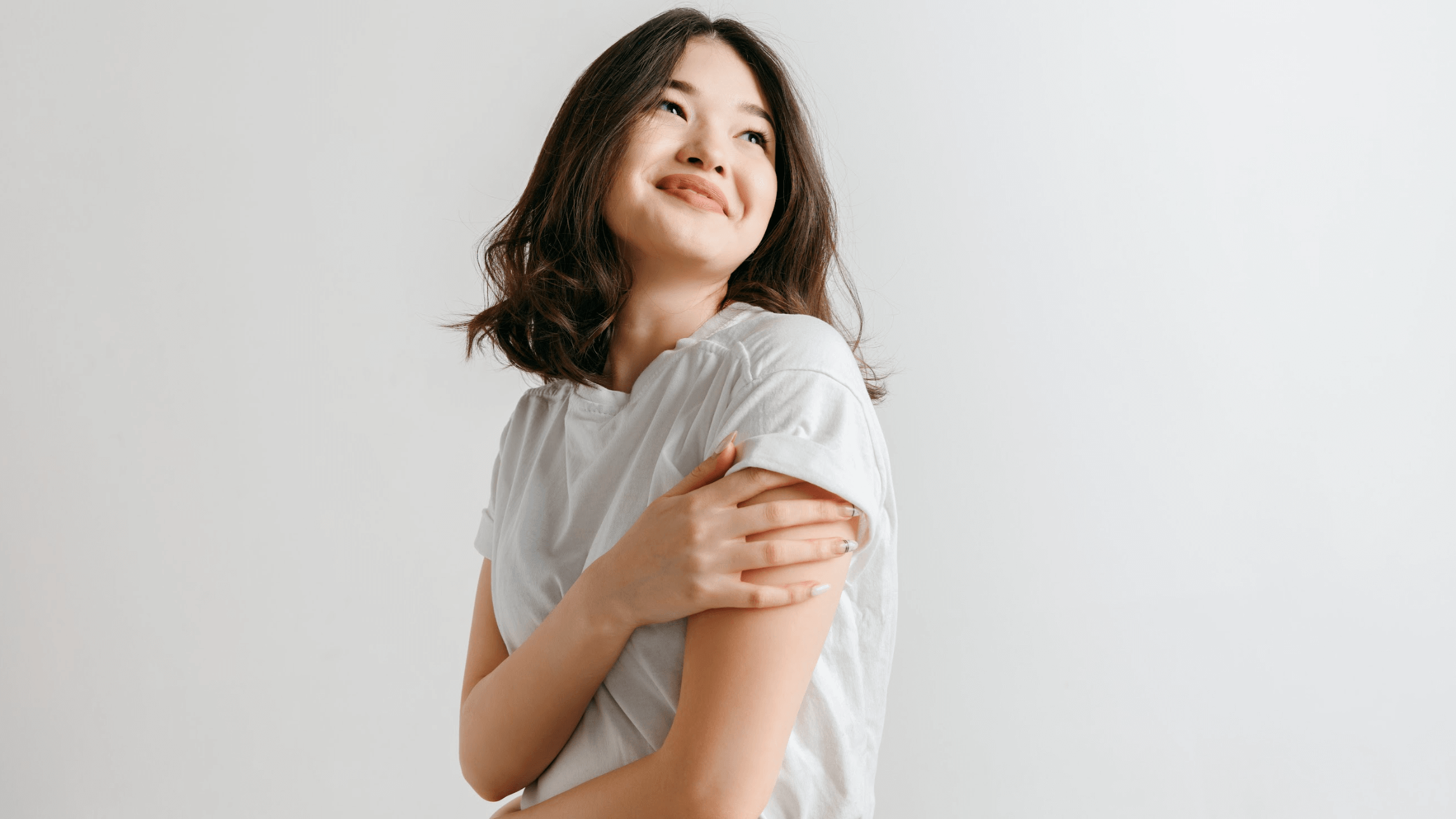 woman smiling and looking off